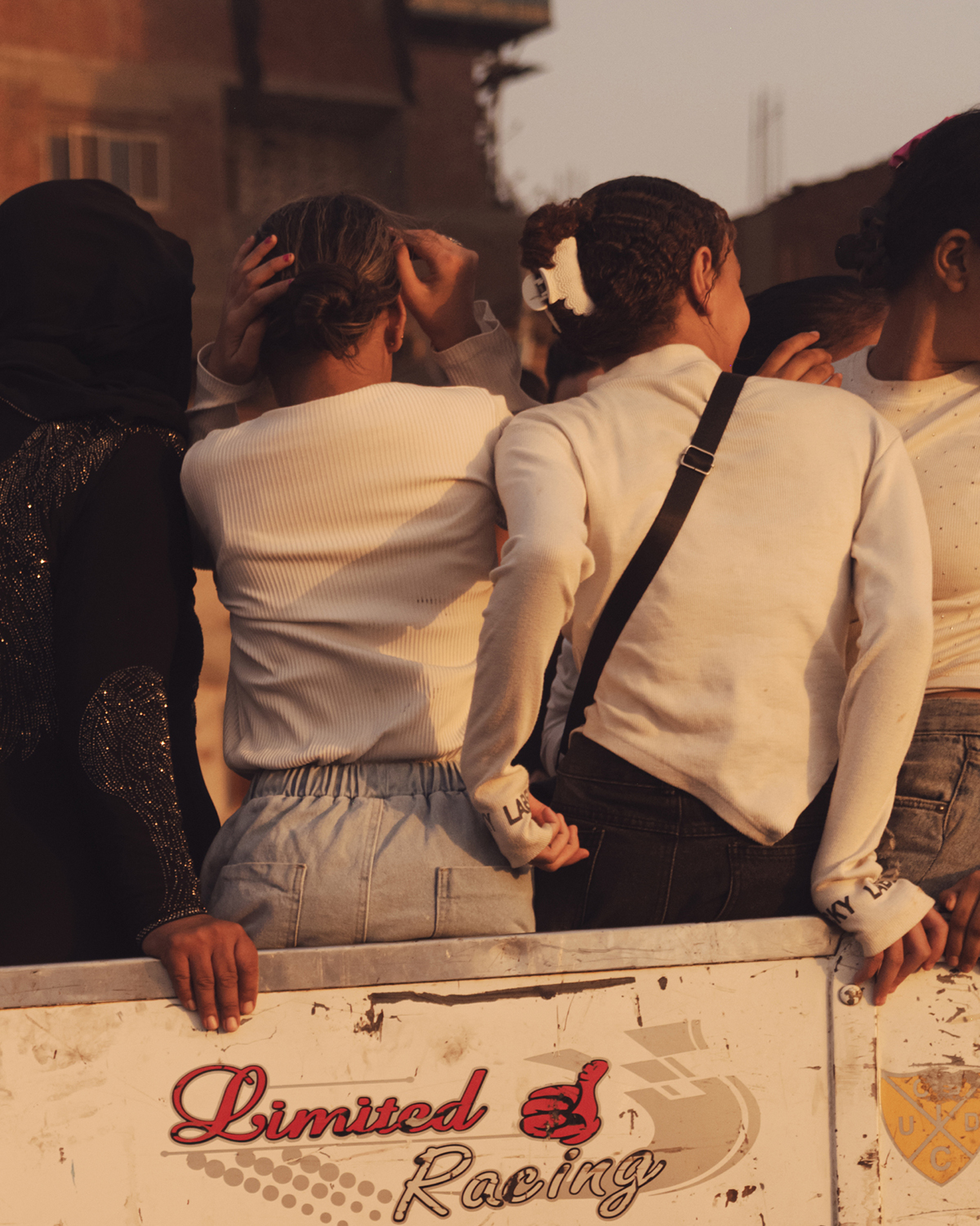 Children in pickup truck at sunset in Cairo, photo by jeroen van de gruiter