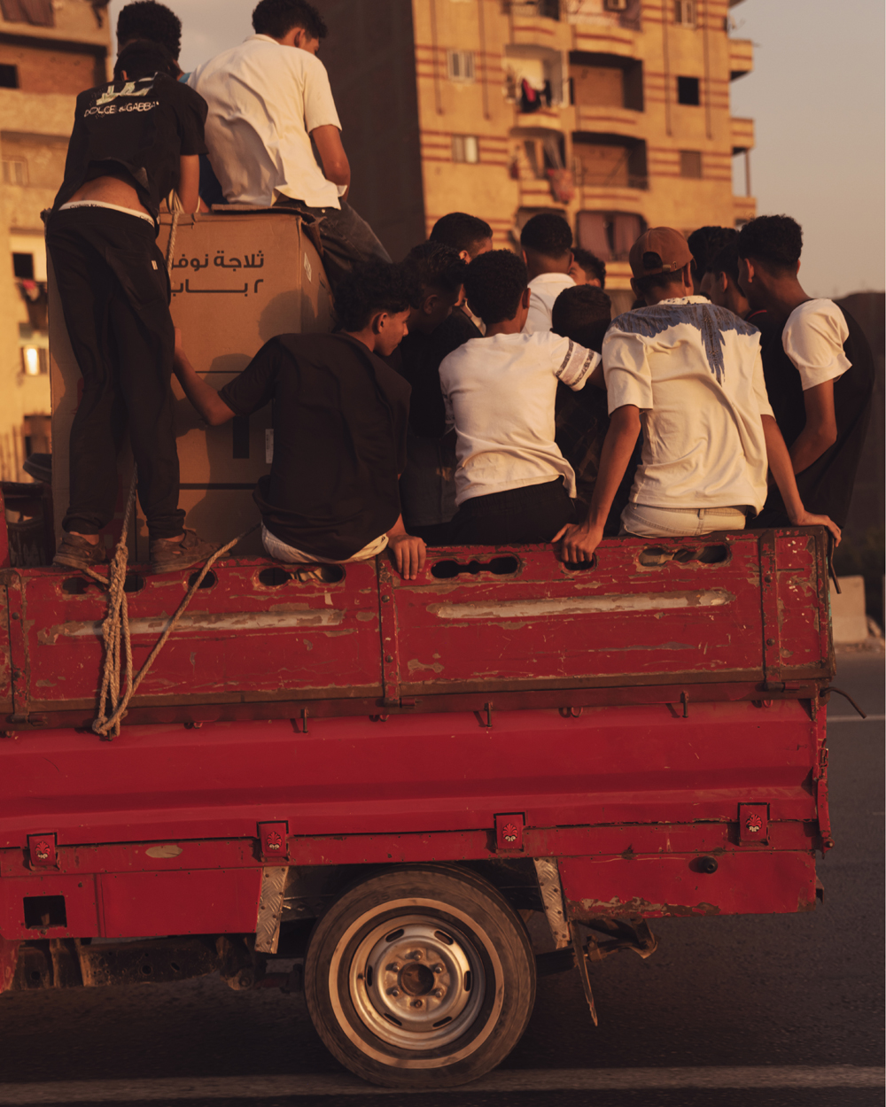 Children riding in pickup truck in Cairo, photo by jeroen van de gruiter, 2025